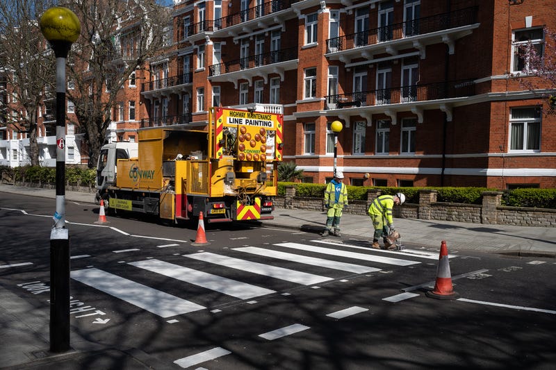 A Highways Maintenance team takes advantage of the COVID-19 coronavirus lockdown and quiet streets to re-paint the iconic Abbey Road crossing on March 24, 2020 in London, England.