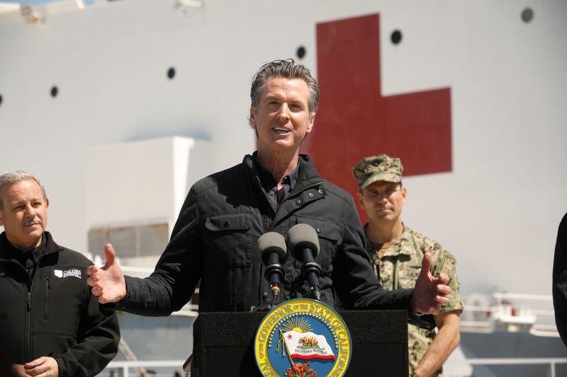 California Governor Gavin Newsom speaks in front of the hospital ship USNS Mercy that arrived into the Port of Los Angeles on Friday, March 27, 2020, to provide relief for Southland hospitals overwhelmed by the coronavirus pandemic.