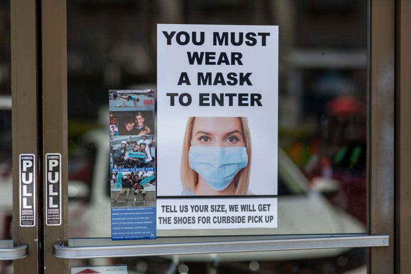 Masks are required for entry to a Shoe City store as Los Angeles County retail businesses reopen while the COVID-19 pandemic continues on May 27, 2020 in Glendale, California.