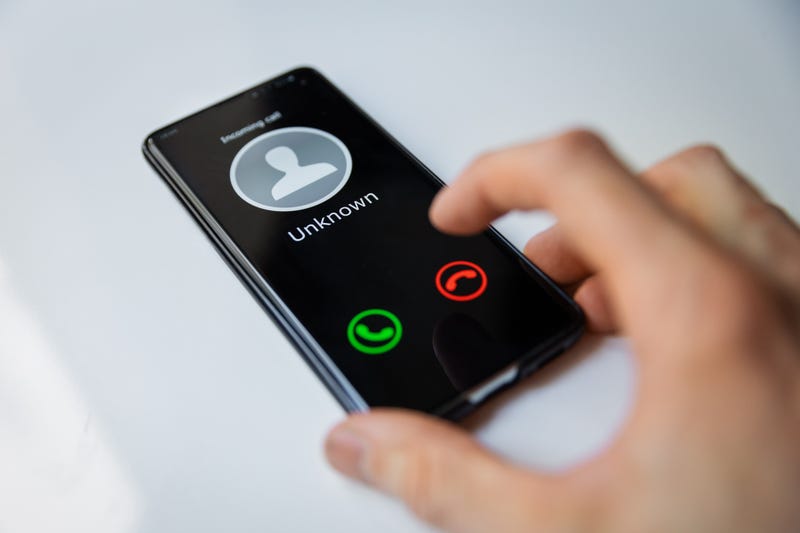 A mobile phone receiving a call from an unknown caller.