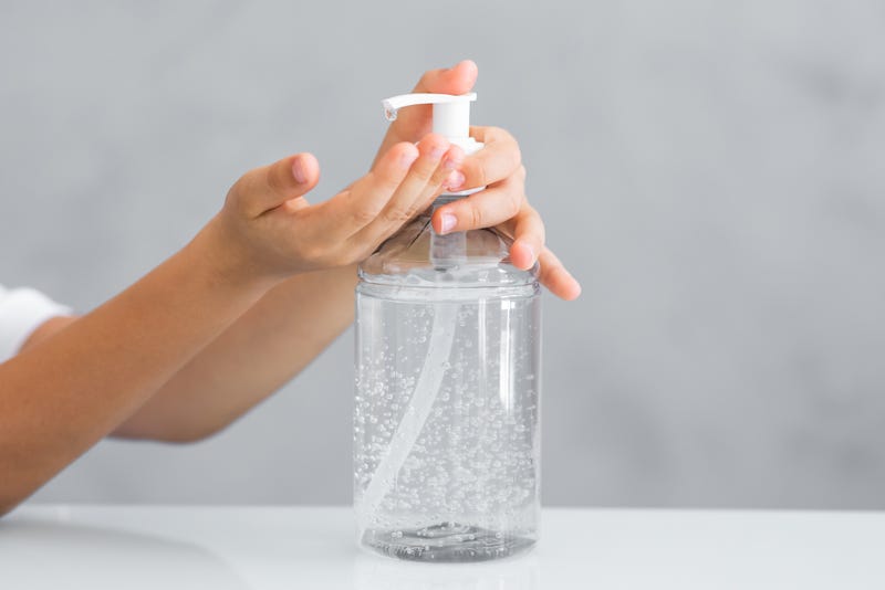 Someone using hand sanitizer