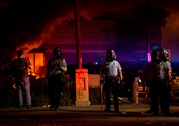 A fire burns inside of an Auto Zone store near the Third Police Precinct on May 27, 2020 in Minneapolis, Minnesota. 
