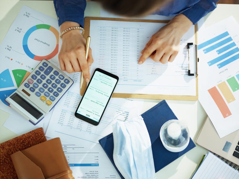 A woman looking at financial figures.