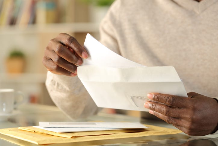 a man is reading the mail