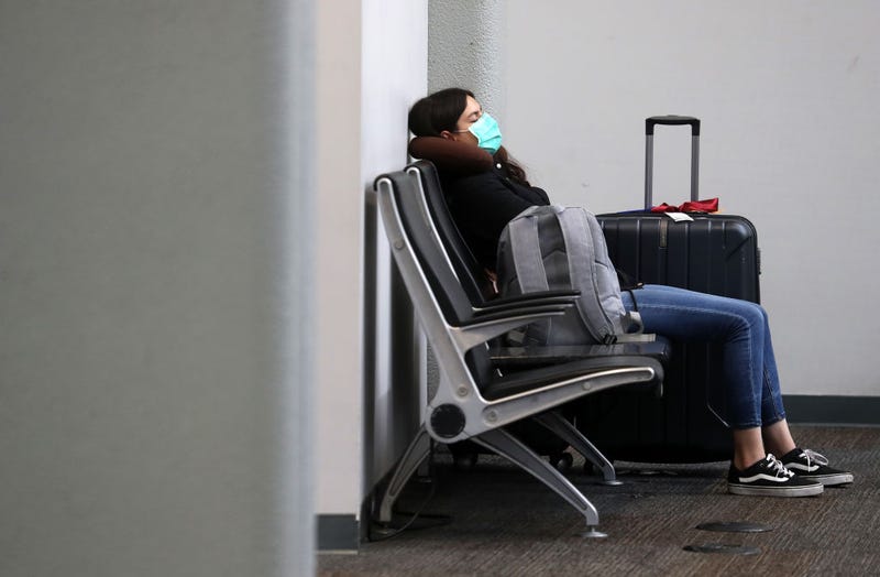 A traveler wears a protective mask while waiting for a flight at San Francisco International Airport on April 02, 2020 in San Francisco, California.