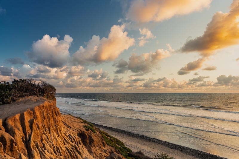 The ground next to the cliff collapsed while the man was walking.