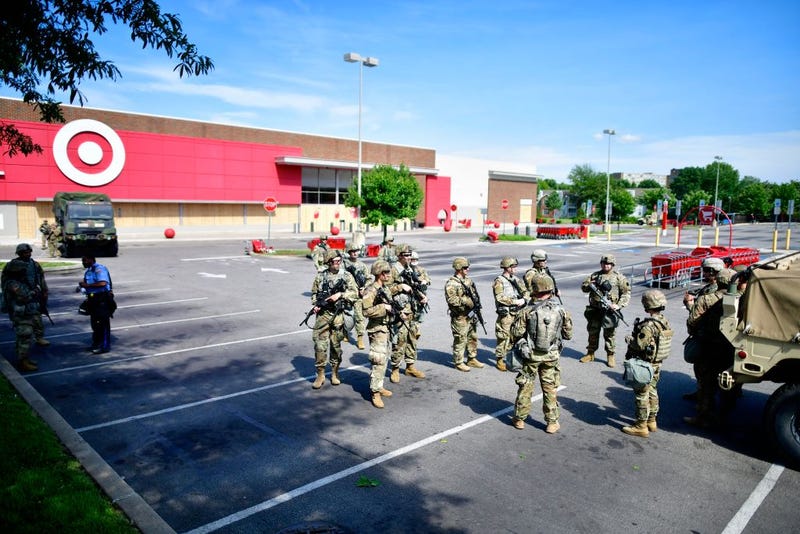 Members of the Pennsylvania National Guard monitor activity outside a shuttered Target store in the aftermath of looting two days ago on June 3, 2020