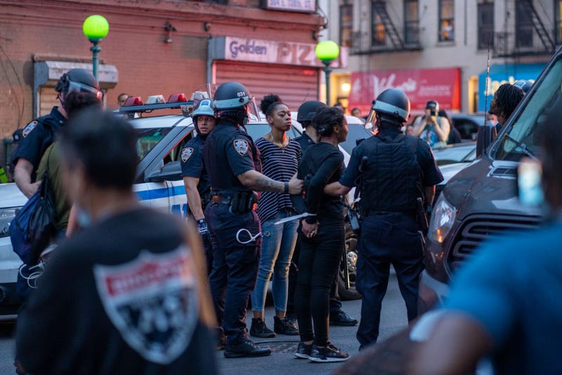 NYPD arrest protesters for breaking the citywide 8:00PM curfew on June 4, 2020, in the Bronx borough of New York City.