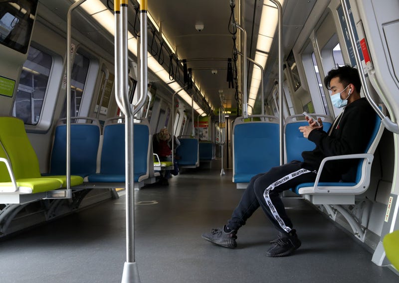  A Bay Area Rapid Transit (BART) passenger wears a protective mask while riding on a train on April 08, 2020 in San Francisco, California. 