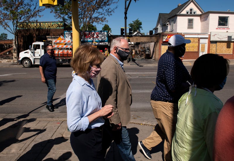 Sen. Tina Smith (D-MN), Minnesota Governor Tim Walz, Minnesota State Sen. Jeff Hayden, and Sen. Amy Klobuchar (D-MN) tour buildings damaged near East Lake Street during the protests and riots that followed the death of George Floyd on June 5, 2020 in Minneapolis, Minnesota. Local business owners and community members spoke with the politicians about the damage to their businesses and the expected impact on the neighborhood.