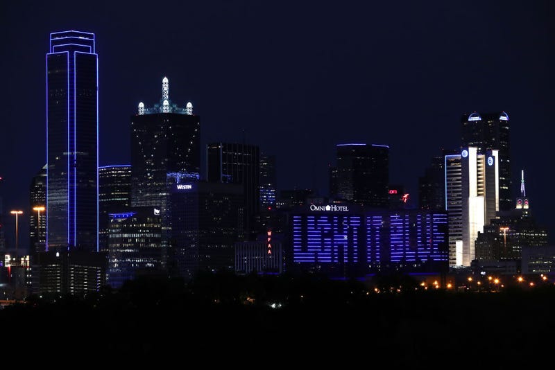 The Omni Dallas Hotel carries the message "Light It Blue" across the skyline on April 09, 2020 in Dallas Texas. Landmarks and buildings across the nation are displaying blue lights to show support for health care workers and first responders on the front lines of the COVID-19 pandemic.