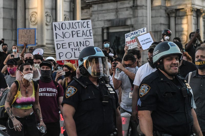 Protesters confront police officers on June 6, 2020 in the Brooklyn borough in New York City.