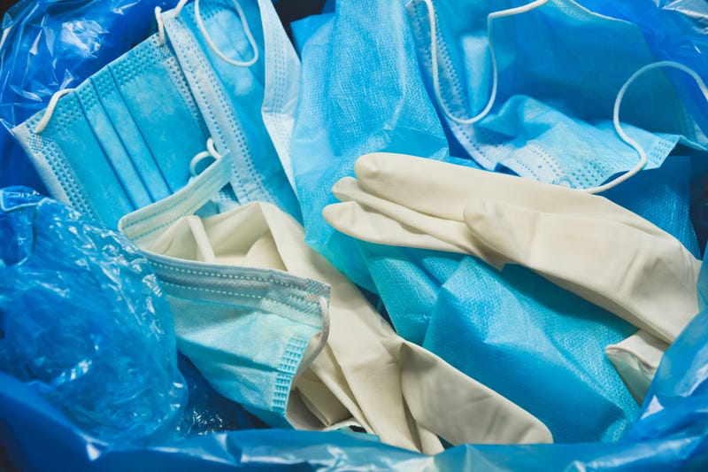 Coronavirus protection equipment in medical waste bin