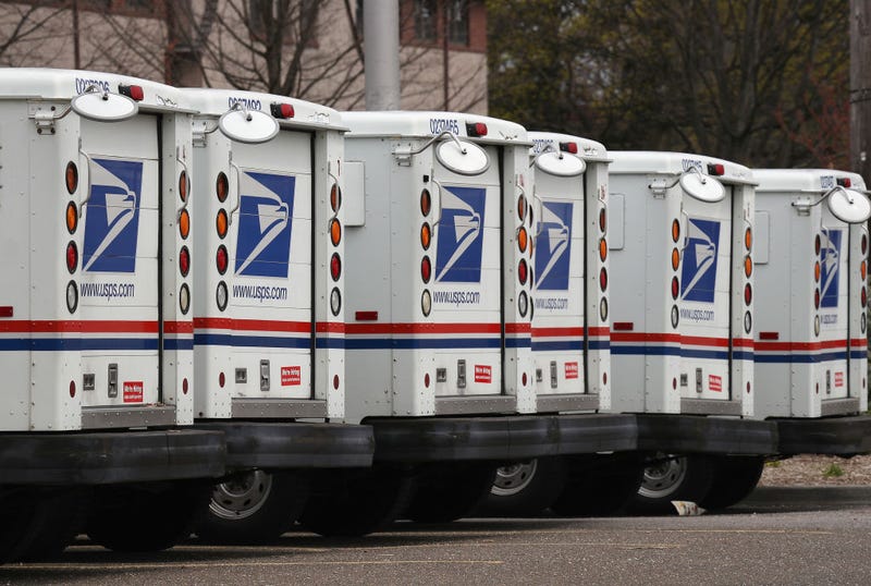 A general view of United States Postal Service trucks on April 12, 2020 in Farmingdale, New York. The USPS requested $75B in government assistance on April 9 to help recover from a large drop in mail volume. (Photo by Bruce Bennett/Getty Images)
