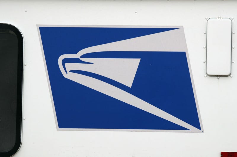 A general view of United States Postal Service trucks on April 12, 2020 in Farmingdale, New York. The USPS requested $75B in government assistance on April 9 to help recover from a large drop in mail volume. (Photo by Bruce Bennett/Getty Images)