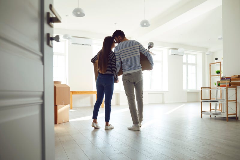 A young couple moves into a new home