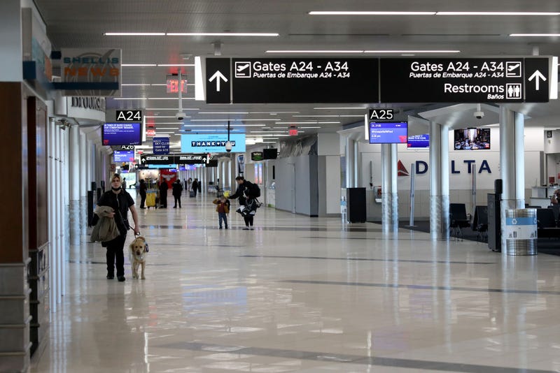 Travelers walk through terminal A at Hartsfield-Jackson Atlanta International Airport on April 20, 2020 in Atlanta, Georgia.