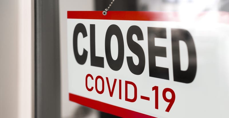 Stock image of "Closed COVID-19" sign