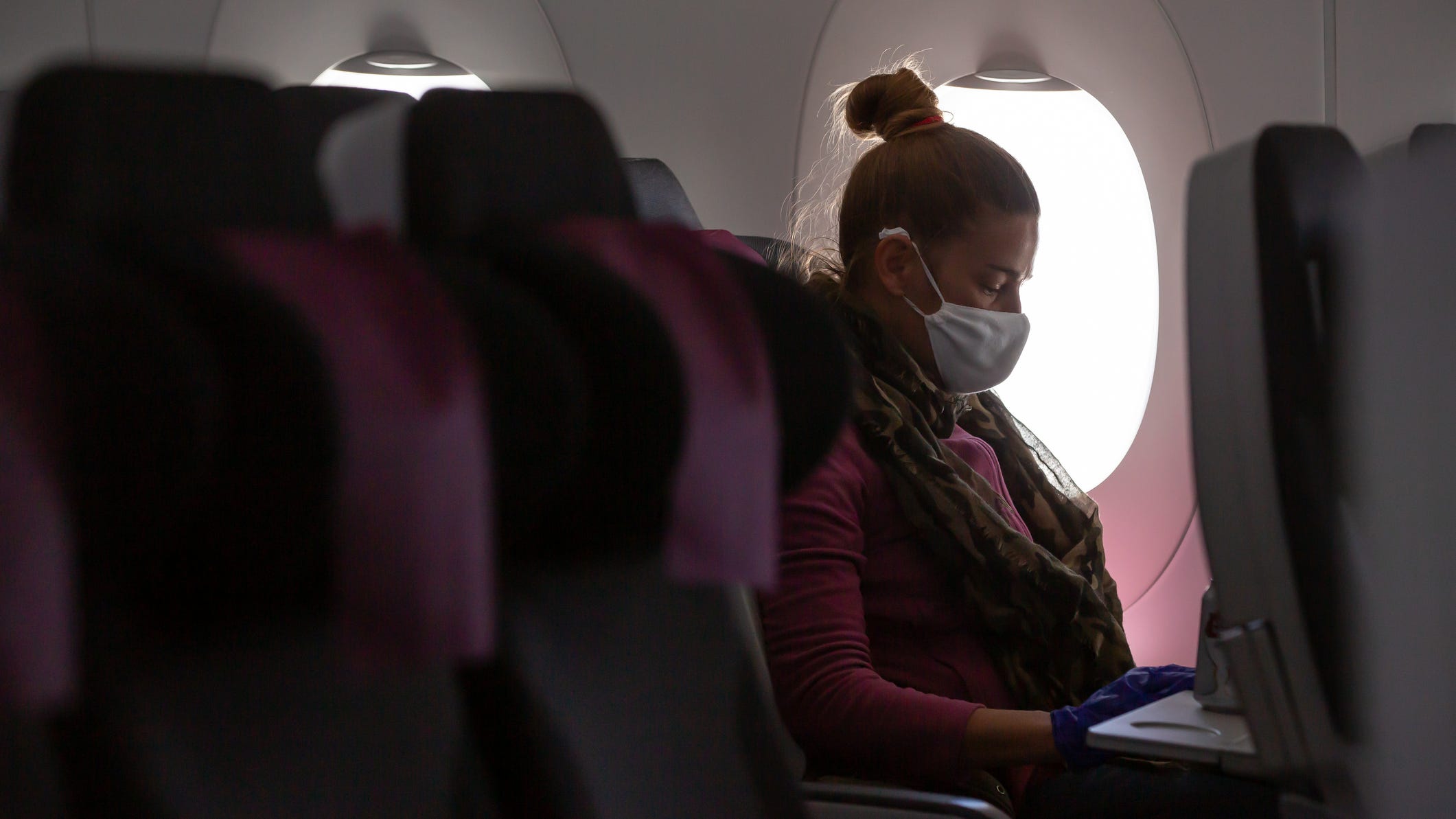 Here's why experts say you should keep wearing your mask on planes