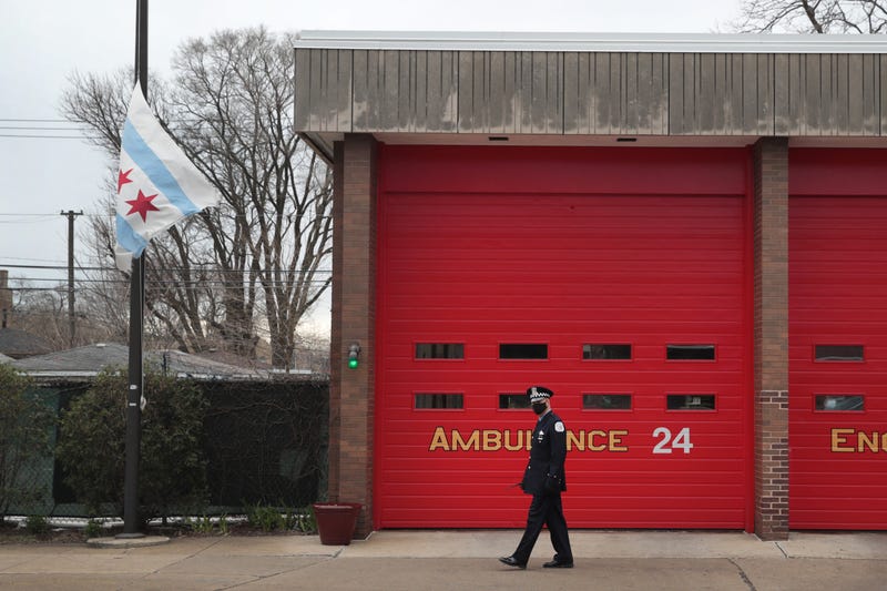 A city of Chicago flag flies at half mast outside of a firehouse near the Taylor Funeral Home where a service was being held for Firefighter Edward Singleton, a 33 year veteran of the Chicago Fire Department, on April 22, 2020 in Chicago, Illinois.