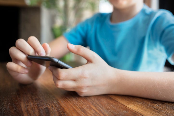 young boy on the phone