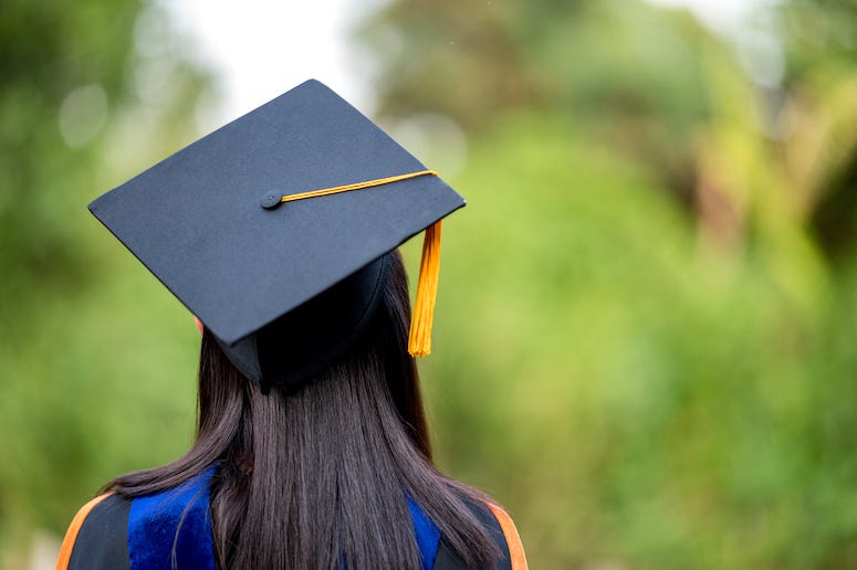 Female graduate wearing cap and gown