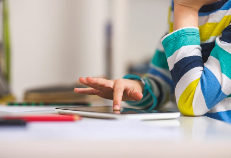 Child hand pointing on Digital tablet