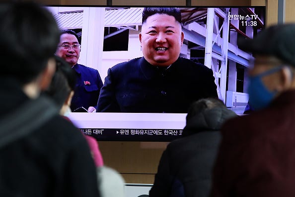 People watch a television broadcast reporting an image of North Korean leader Kim Jong-un during a news program on May 02, 2020 in Seoul, South Korea.
