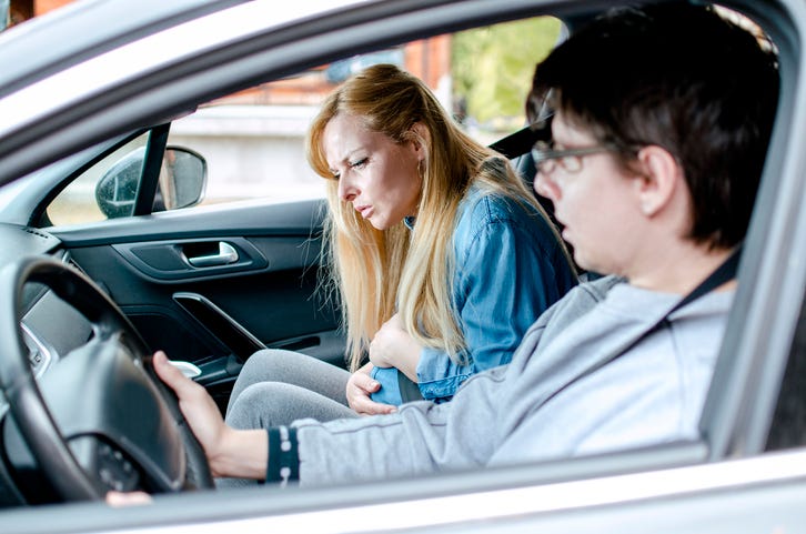 Pregnant couple in car
