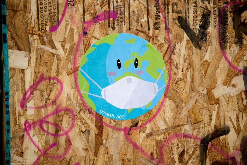 A recently painted mural of a world and a mask is displayed on a board during the coronavirus pandemic on May 03, 2020 in San Francisco, California.