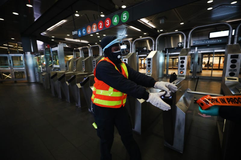 An MTA worker closes down a station for cleaning