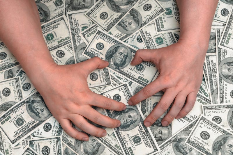Hands grabbing money