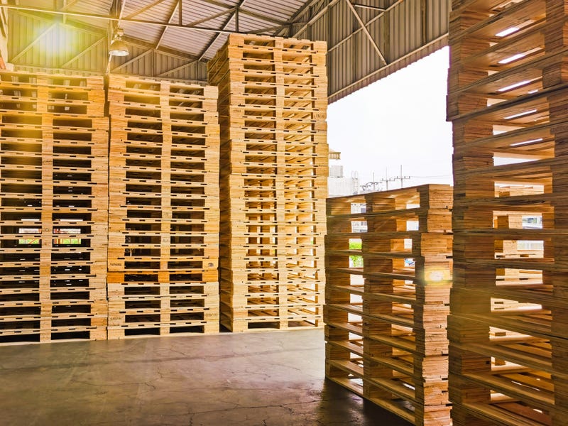 Wooden pallets stack at the freight cargo warehouse 
