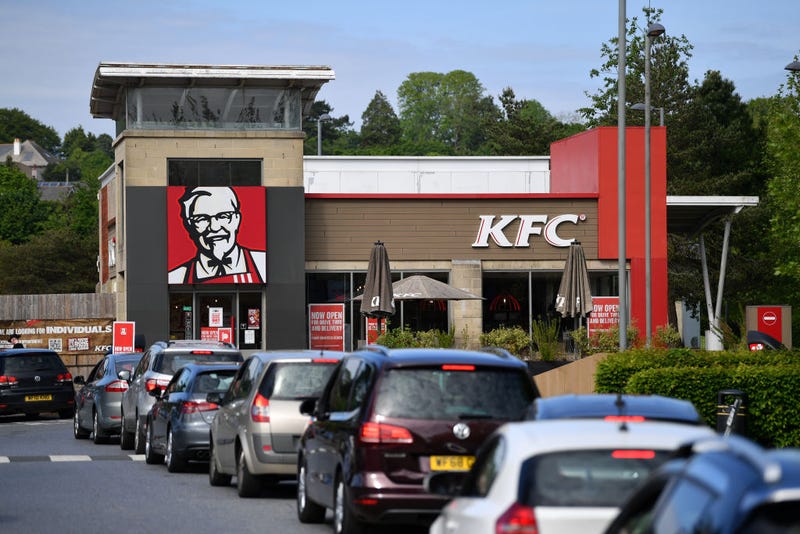  A long queue of cars forms as the KFC drive through re-opens to the public on May 08, 2020 in Plymouth, England. 