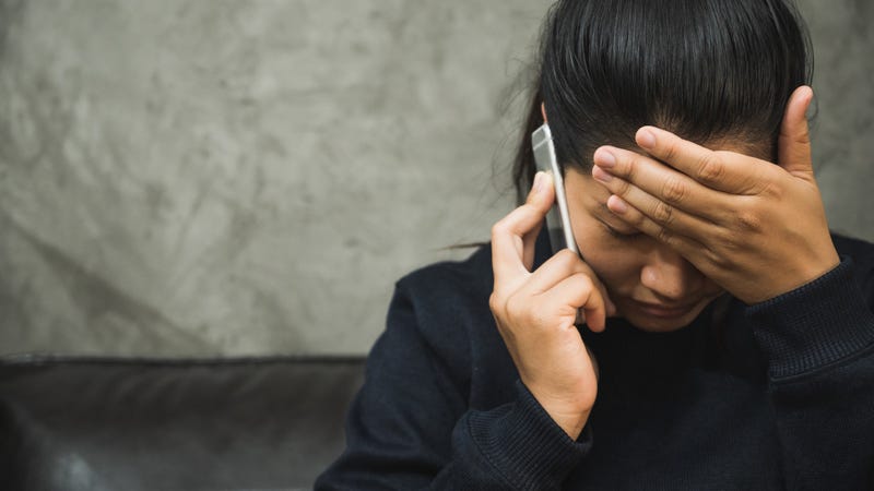 A woman calling a mental health crisis line.