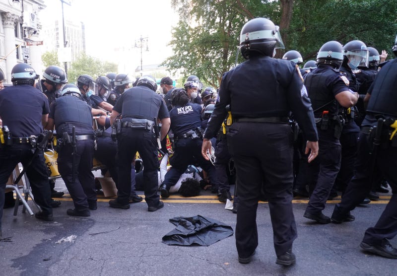 Protesters and police officers clash for the second morning in a row on July 1, 2020 in New York City