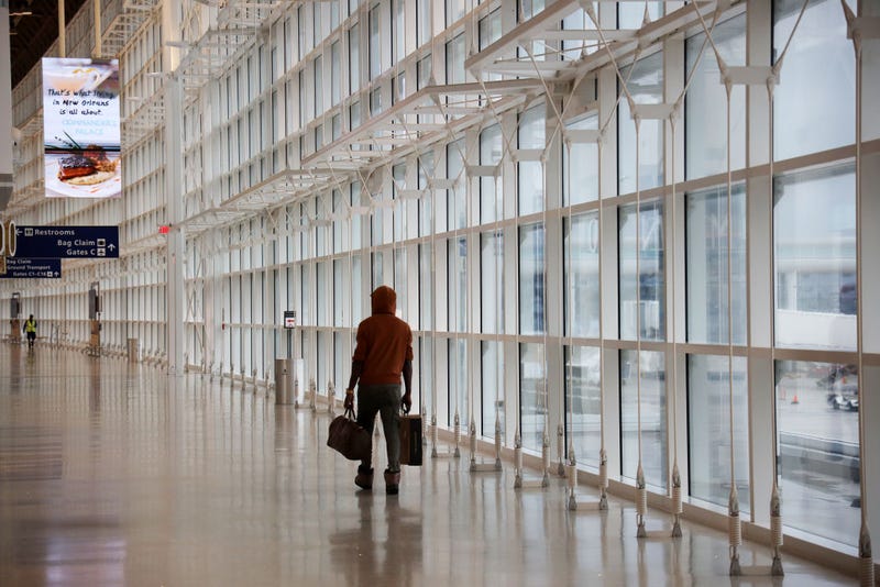 Passengers walk between terminals at Louis Armstrong International Airport on May 15, 2020 in New Orleans, Louisiana. (Photo by Chris Graythen/Getty Images)