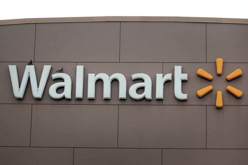 A sign hangs outside of a Walmart store on May 19, 2020.