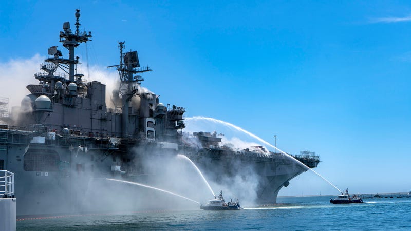 Boats combat a fire aboard USS Bonhomme Richard at Naval Base San Diego on July 12, 2020.