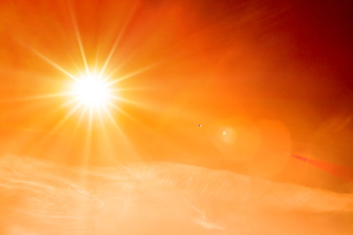 bright sunshine in hazy orange sky