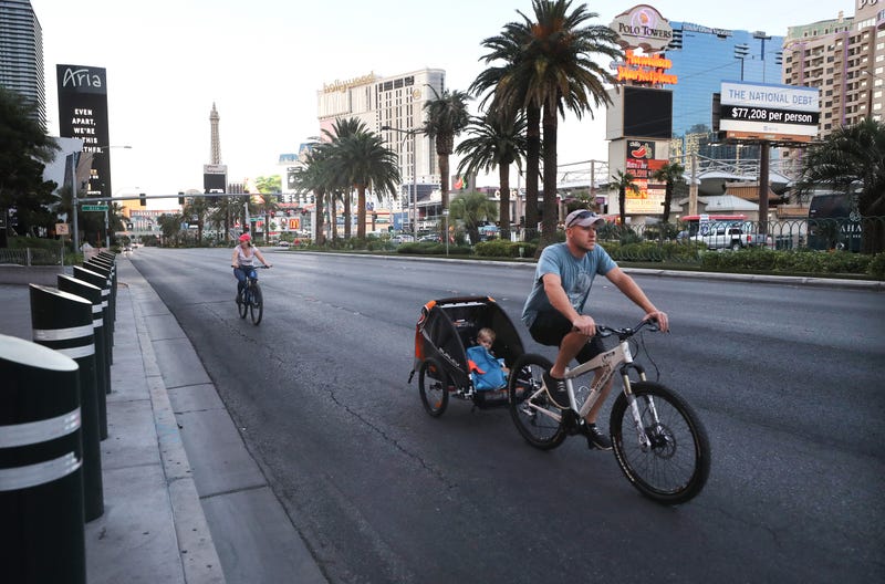 yclists pass on the Las Vegas Strip, where most businesses have been closed since March 17 in response to the coronavirus (COVID-19) pandemic, on May 23, 2020 in Las Vegas, Nevada.
