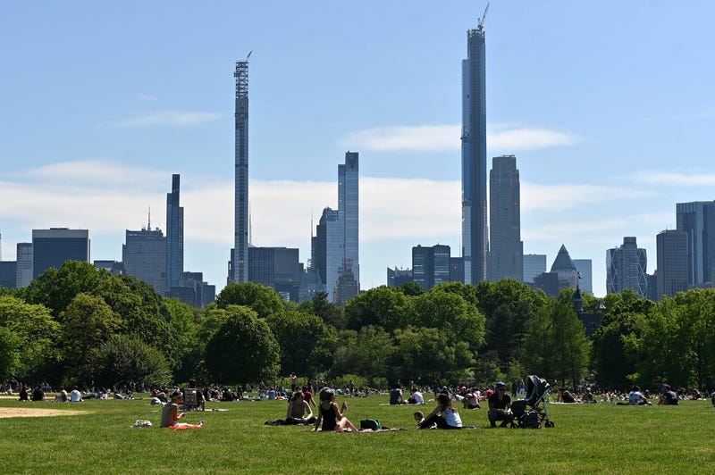 People sit on The Great Lawn in Central Park on Memorial Day during the coronavirus pandemic.