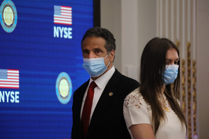 File photo: Governor Andrew Cuomo walks past his daughter Mariah Kennedy-Cuomo as he holds his daily press briefing at the New York Stock Exchange (NYSE) on the first day that traders are allowed back onto the historic floor of the exchange on on May 26, 2020 in New York City