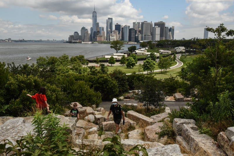 People climb to the highest point on Governors Island on July 15, 2020 in New York City
