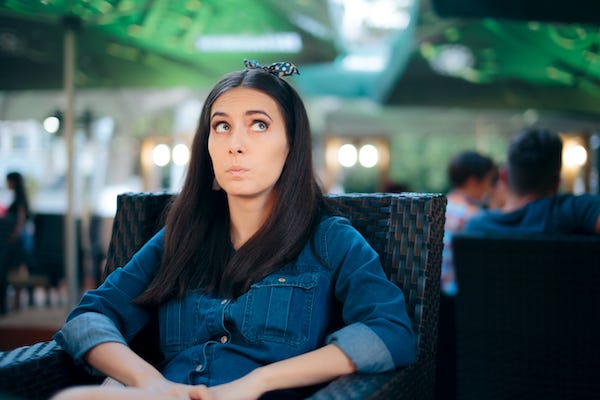 Woman overhearing conversation at a restaurant