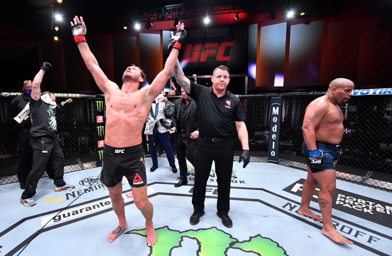 Stipe Miocic celebrates after his victory over Daniel Cormier in their UFC heavyweight championship bout during the UFC 252 event