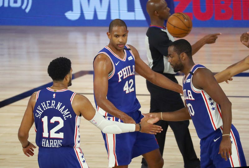 Al Horford #42 of the Philadelphia 76ers celebrates with Tobias Harris #12 and Alec Burks #20