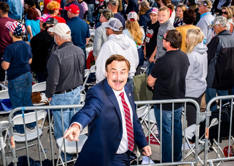  Mike Lindell (L), founder of My Pillow Inc., points to the crowd during a rally for President Donald Trump at the Bemidji Regional Airport on September 18, 2020 in Bemidji, Minnesota.