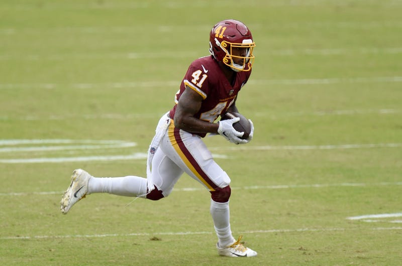 J.D. McKissic turns into open field.