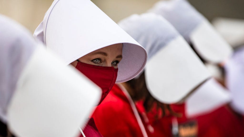 Protesters in ‘Handmaid’s Tale’ gear disrupt Mass